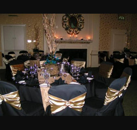Black Chair Covers with Stunning Gold Bands and Gold Table Runners, Close House Hotel