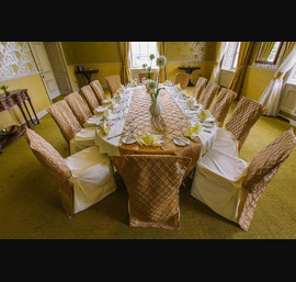 The Venetian Suite Dressed for Private Dining - Gold Pintuck Tafferta Table Runner with Matching Chair Veils on Butter Table Linen and Chair Covers