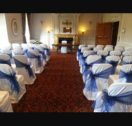Dark blue sashes on white linen at Crathorne Hall
