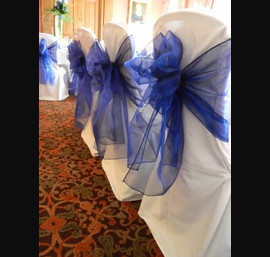 Blue sashes on top table at Crathorne Hall