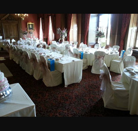 Dusky pink and champagne double sashes on butter linen at Crathorne Hall