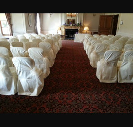 Champagne organza sashes on butter linen at Crathorne Hall set as a civil ceremony