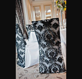 Black Flock Chair Backs on White Chair Covers at Rockliffe Hall