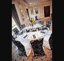 Black Flock Chair Backs on White Chair Covers at Rockliffe Hall
