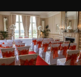 Orange Organza Bows on White Chair Covers in the Morning Room - Photo by Stan Seaton