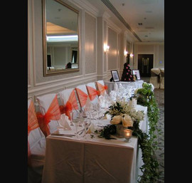 Burnt Orange Organza Side Sash, on white chair covers, Rockliffe Suite, Rockliffe Hall Hotel