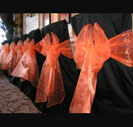 Black Chair Covers with Burnt Orange Sash at Rockliffe Hall Hotel, Darlington