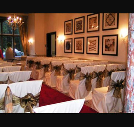 Wedding at Rockliffe Hall, Darlington - Butter Chair Cover with Bronze Organza Sash