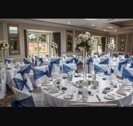 Navy Organza Side Bows with White Chair Covers in the Rockliffe Suite - Photos by Stan Seaton