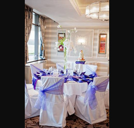Two Tone Purple Organza Sash on White Chair Covers with Luxury Purple Runner on a White Table Cloth at Rockliffe Hall