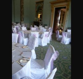 Lilac sashes on white linen at Wynyard Hall