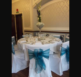 Teal Organza Sashes on White Chair Covers