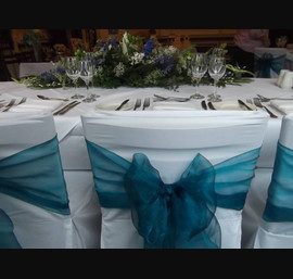 Teal Organza Sashes on White Chair Covers