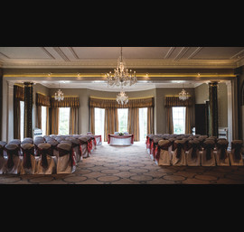 Claret sashes on white chair covers at Rudding Park