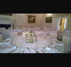 White chaircovers with champagne flocked organza sashes at Goldsborough Hall