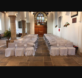 Silver organza sashes on white chair covers, All Saints Church, Kirkby Overblow