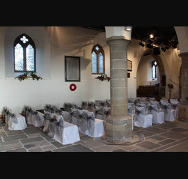 Silver organza sashes on white chair covers, All Saints Church, Kirkby Overblow