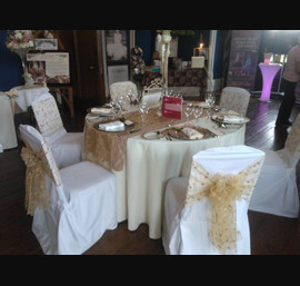 Gold embroidered organza Sashes on white chair covers. Gold pintuck tabel runner at Allerton