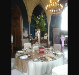 Gold embroidered organza Sashes on white chair covers. Gold pintuck tabel runner at Allerton Castle