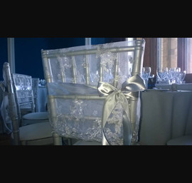 Silver lace chair hood on silver Chiavari chairs at Allerton castle