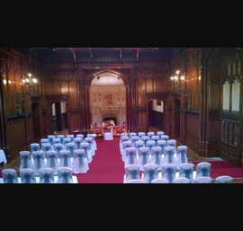 Sea green organza sashes on white chair covers at Allerton castle