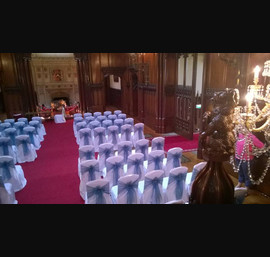 Sea green organza sashes on white chair covers at Allerton castle