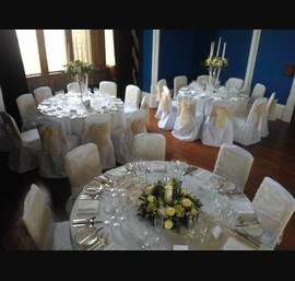 Champagne flocked organza sashes on White Chair Covers at Allerton Castle