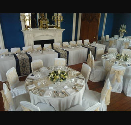 Champagne flocked organza sashes on White Chair Covers at Allerton Castle