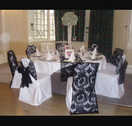 Black Flocked organza sash and chair veil on white chair covers. Cairn Hotel, Harrogate