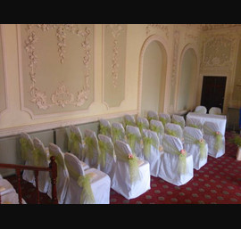 Apple Organza sashes on white chair covers. The Bridge Hotel, Walshford