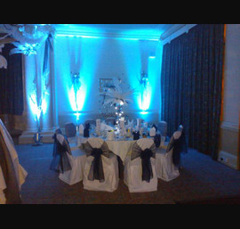 Black organza and flocked sashes on white chair covers at The Cairn Hotel, Harrogate