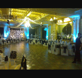 Black organza and flocked sashes on white chair covers at The Cairn Hotel, Harrogate