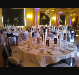 Black organza and flocked sashes on white chair covers at The Cairn Hotel, Harrogate