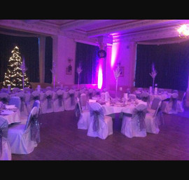 Silver organza sashes on white chair covers at The Cairn Hotel, Harrogate
