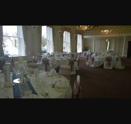 Claret Organza sashes with lace overlays on white chair covers at Cedar Court Hotel