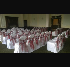 Claret Organza sashes with lace overlays on white chair covers at Cedar Court Hotel