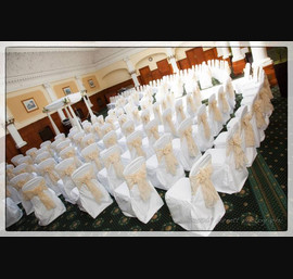 Champagne flock sashes on white chair covers at the Old Swan Hotel, Harrogate