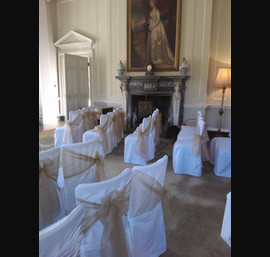 Antique gold sashes, on white chair covers The Ceremony Room,Newburgh Priory