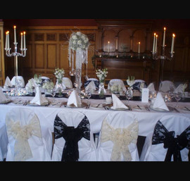 Black and Champagne flocked organza sashes on white chair covers in the Byron Room, Crown Hotel, Harrogate