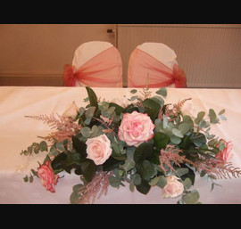 Pink/gold organza sashes on white chair covers on the Registrars table, at the Crown Hotel Harrogate