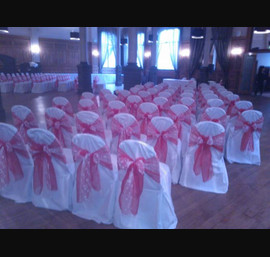 Red Organza sashes with lace inserts on White Chair Covers at the Crown Hotel Harrogate