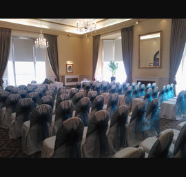 Peacock Organza Sashes on white chair covers at the Crown Hotel Harrogate