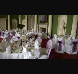 Aubergine Organza Sashes on white chair covers at Hazlewood Castle