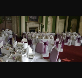 Aubergine Organza Sashes on white chair covers at Hazlewood Castle
