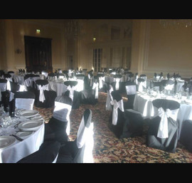 White Satin sashes on Black chair covers at the Majestic Hotel