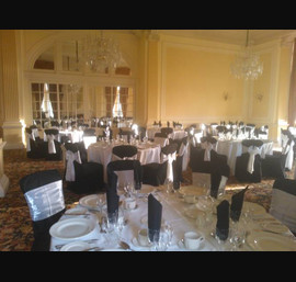 White Satin sashes on Black chair covers at the Majestic Hotel