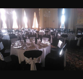 White Satin sashes on Black chair covers at the Majestic Hotel