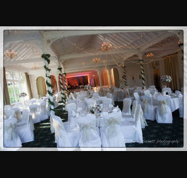 Champagne flock sashes on white chair covers at the Old Swan Hotel, Harrogate
