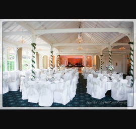 Champagne flock sashes on white chair covers at the Old Swan Hotel, Harrogate