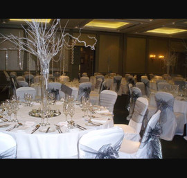 Silver organza sashes on white chair covers, Oulton Hall Leeds